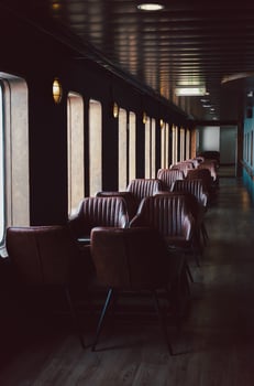 Interior with leather seat in perspective row next to window. photo
