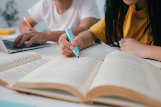 Young students campus helps friend catching up and learning. photo