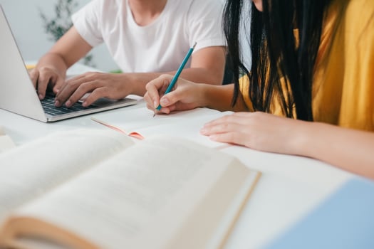 Young students campus helps friend catching up and learning. photo