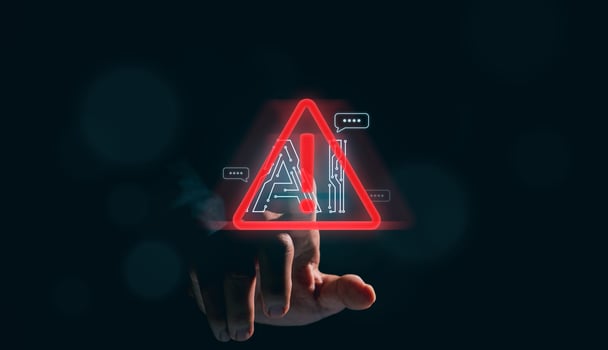 Business man holding digital chatbot Artificial Intelligence AI with hacking and warning alert. cyber attack network, spyware or Malicious software. Technology cyber security and cybercrime. photo