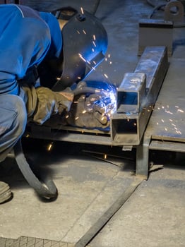 Welding Work with Equipment for Steel Metal, Iron, Sparks at Manufacturing Heavy Industry Factory, Indoor photo