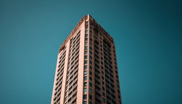 Modern skyscraper reflects futuristic design in illuminated cityscape at night generated by AI photo