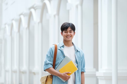 Young male student at university campus. photo