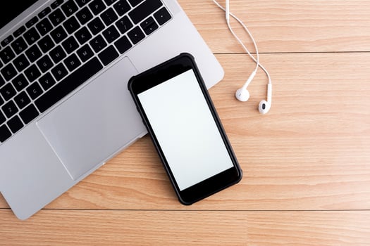 Top view of designer workplace with mock up smartphone on table. photo