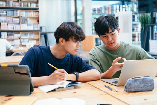Young students campus helps friend catching up and learning. photo