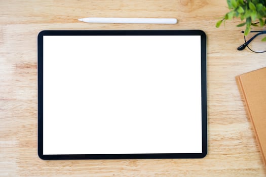 Digital tablet mockup on office working table photo
