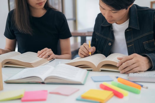 Young students campus helps friend catching up and learning. photo