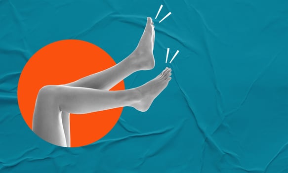 Art collage, beautiful women's legs from a circle on a blue wet, paper background. photo