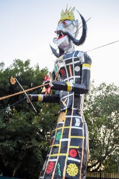 Ravnans being ignited during Dussera festival at ramleela ground in Delhi, India, Big statue of Ravana to get fire during the Fair of Dussera to celebrate the victory of truth by Lord Rama photo