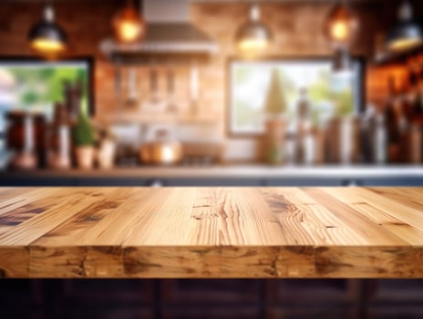Empty wooden table with copy space, blurred kitchen background. . photo