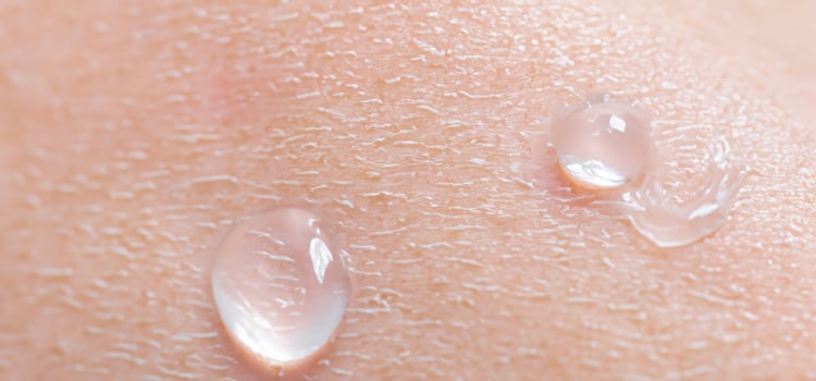 Collagen And Hyaluron Serum Gel On Skin. Splashing of Hyaluron gel. photo