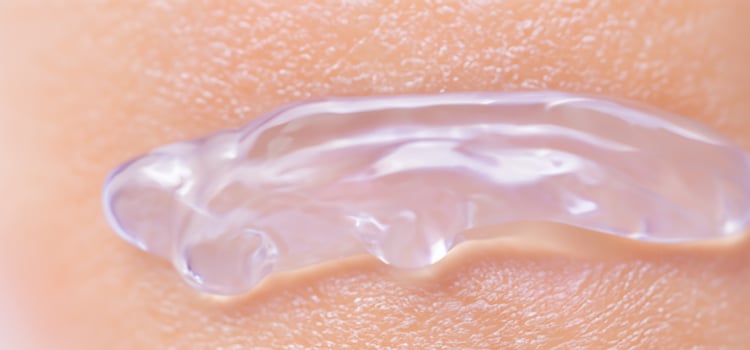 Collagen And Hyaluron Serum Gel On Skin. Splashing of Hyaluron gel. photo