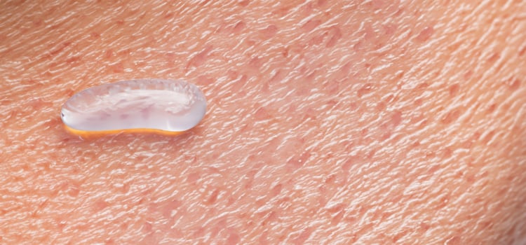 Collagen And Hyaluron Serum Gel On Skin. Splashing of Hyaluron gel. photo
