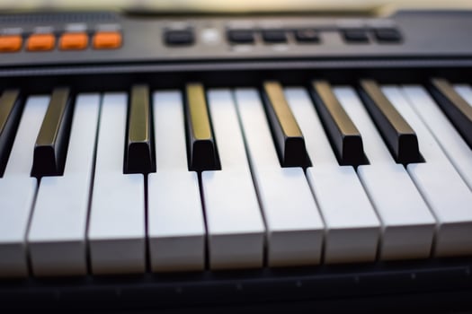 Close-up of piano keys. Piano black and white keys and Piano keyboard musical instrument placed at the home balcony during sunny day. photo