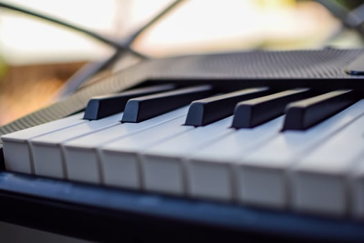 Close-up of piano keys. Piano black and white keys and Piano keyboard musical instrument placed at the home balcony during sunny day. photo