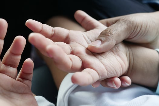 father holding hand of baby child, close up . photo