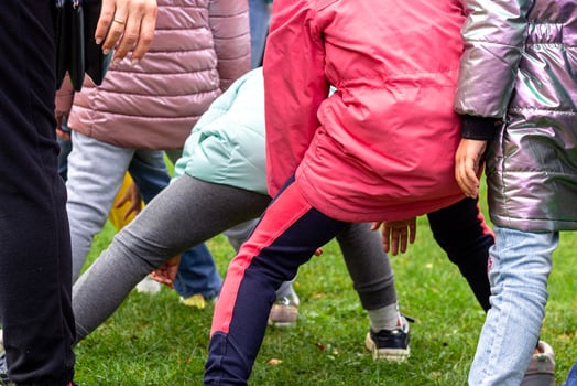 Photo children in jackets playing outdoor games