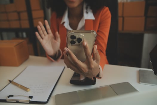 Startup small business entrepreneur or freelance Asian woman using a laptop with box, Young success Asian woman with her hand lift up, online marketing packaging box and delivery, SME concept. photo