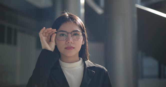 Portrait of Young woman dressed in formal business standing in workplace. photo