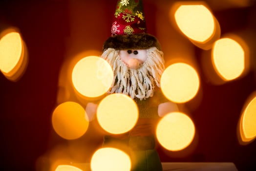 a santa claus doll with a beard and hat photo