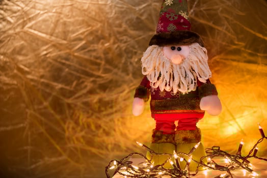 a santa claus doll with a beard and hat photo