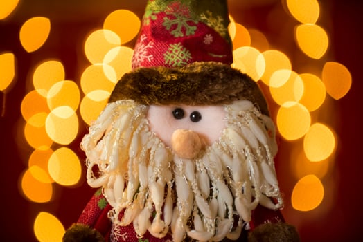 a stuffed gnome sitting on a chair photo