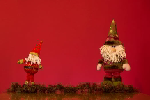 a santa claus doll with a beard and hat photo