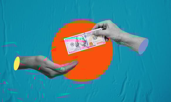 Big businessman hand gives money dollars on blue paper background. photo