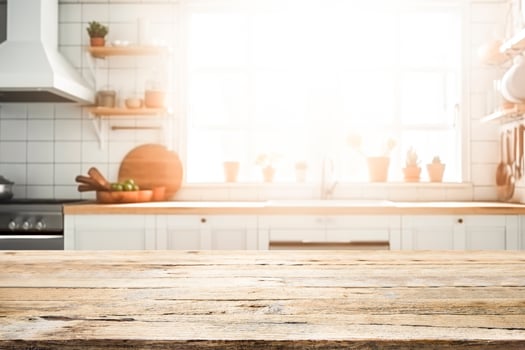 Empty Wood table top on blurred kitchen background. photo