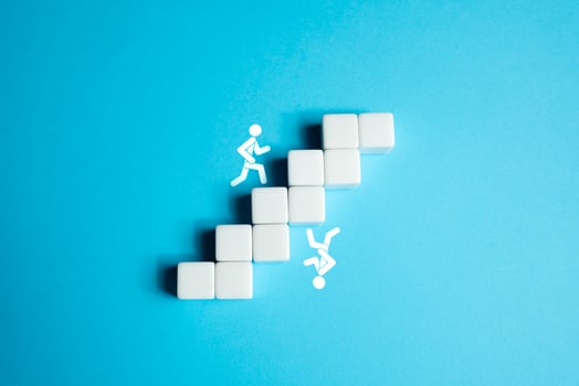People are chasing each other up the inverted stairs. The illusion of repeating the success of another person. Delusion in goals and desires. Competition, rivalry. photo