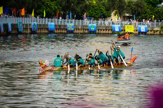 Ho Chi Minh, Viet Nam - 23 April 2023 Blurry motion of boat racing in the traditional Ngo boat racing festival of Khmer people photo
