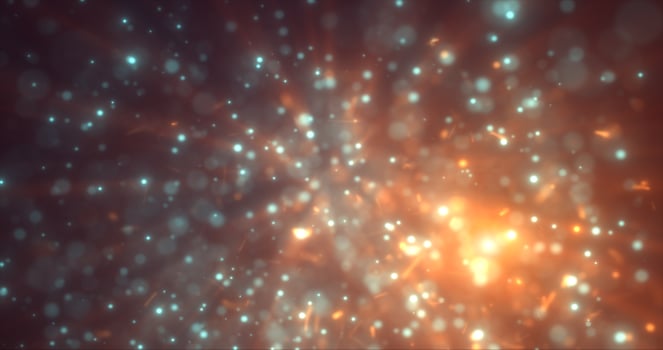 Abstract yellow orange energy particles and dots glowing flying sparks festive with bokeh effect and blur background photo