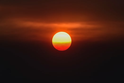 Orange sunset with clouds, in Pampas province, Argentina photo