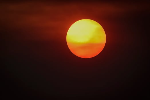 Orange sunset with clouds, in Pampas province, Argentina photo