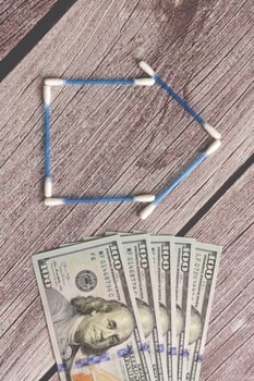 Buy a house, saving concept in dollars photo