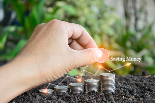 Businessman holding stacks of coins Money Savings Concepts for Financial Accounts photo