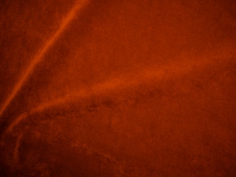 Orange velvet fabric texture used as background. orange fabric background of soft and smooth textile material. There is space for text. photo