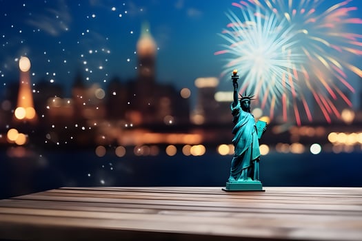 Wood table and statue of liberty with blur background. photo