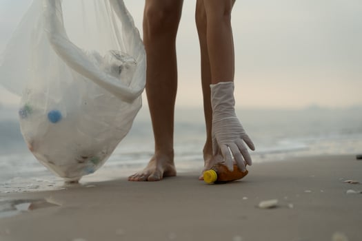 Save ocean. Volunteer pick up trash garbage at the beach and plastic bottles are difficult decompose prevent harm aquatic life. Earth, Environment, Greening planet, reduce global warming, Save world photo