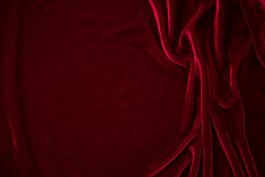 Red velvet fabric texture used as background. red panne fabric background of soft and smooth textile material. crushed velvet .luxury scarlet for silk. photo