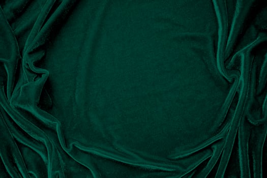 Green velvet fabric texture used as background. Peacock color panne fabric background of soft and smooth textile material. crushed velvet .luxury emerald tone for silk. photo