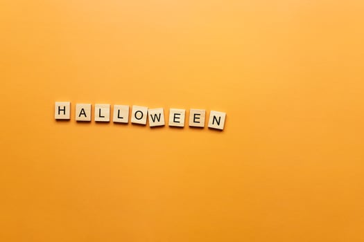 Halloween word on orange background photo