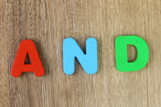The arrangement of wooden letters that form the word and photo