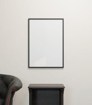 minimal of frame mockup poster on the white wall above the stylist table and  sofa in the minimalist room photo