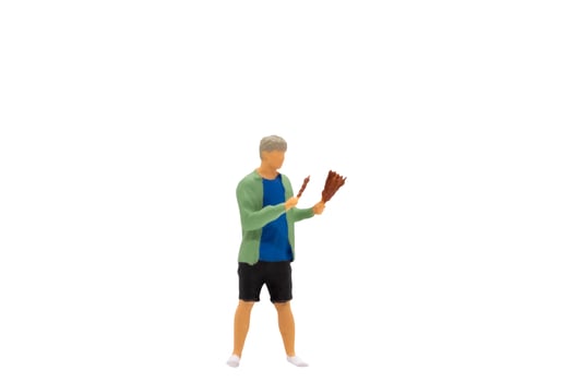 Miniature people Young man grilling BBQ photo