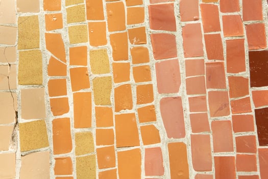 Colorful ceramic mosaic on the walls of the building. Abstract background and texture for design. photo