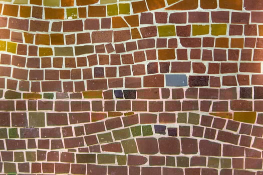 Colorful ceramic mosaic on the walls of the building. Abstract background and texture for design. photo