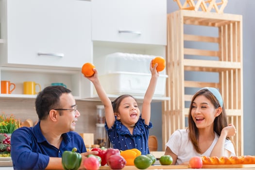 Father mother and daughter cooking together in the kitchen, Happy Asian family concepts photo