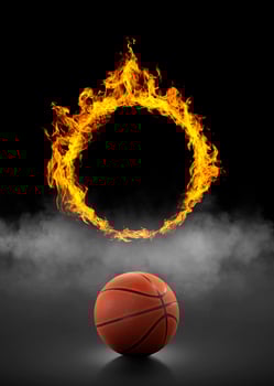 basketball ball and ring, of fire in black smoke background photo