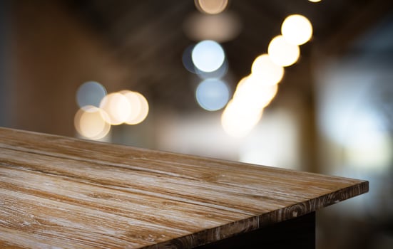 Wood Table Top in Blur Background room interior with empty copy space. photo